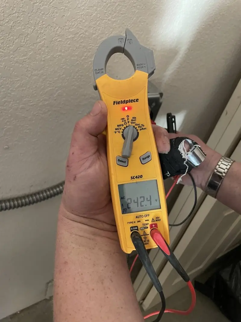 Voltage testing with clamp meter during Whole House Surge Protector in Phoenix